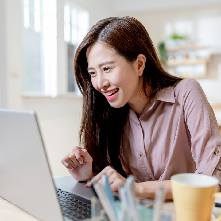 smiling lady on a laptop - Private Classes