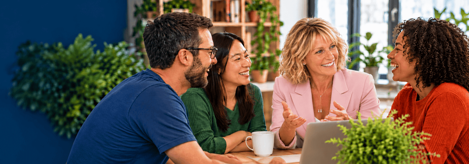 Four adults enjoying a conversation together